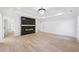 Large, open living room featuring recessed lighting, modern fireplace and beautiful flooring at 3205 Bold Springs Rd, Dacula, GA 30019