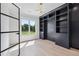 Bright office features built-in shelving, stylish light fixture, and a large window with a picturesque view at 3205 Bold Springs Rd, Dacula, GA 30019