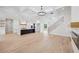 Open concept living space featuring hardwood floors, a modern kitchen, and a staircase leading to the upper level at 3205 Bold Springs Rd, Dacula, GA 30019