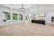 Expansive open floorplan showcasing the living room, kitchen, and outdoor views through large windows at 3205 Bold Springs Rd, Dacula, GA 30019