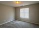 Bedroom featuring neutral paint, carpet, and a window with blinds at 4044 Robin Cir, Atlanta, GA 30349