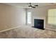 Bright living room featuring a fireplace, neutral walls, and plush carpet at 4044 Robin Cir, Atlanta, GA 30349