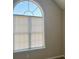 Arched window with sunlight illuminating through the blinds at 4044 Robin Cir, Atlanta, GA 30349