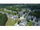 An elevated aerial perspective reveals the meticulously planned community with verdant lawns, tree-lined streets, and a welcoming ambiance at 646 Lakes Cir, Lithonia, GA 30058