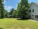Expansive backyard featuring a well-maintained lawn and privacy fence, perfect for outdoor activities at 646 Lakes Cir, Lithonia, GA 30058