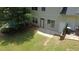 A charming backyard featuring a well-maintained lawn and a cozy patio area, perfect for relaxing and entertaining at 646 Lakes Cir, Lithonia, GA 30058