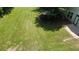 A spacious backyard with mature tree coverage provides shade and privacy, creating a serene outdoor oasis at 646 Lakes Cir, Lithonia, GA 30058