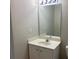 Bathroom featuring a single sink vanity, a mirror, and a light fixture at 646 Lakes Cir, Lithonia, GA 30058