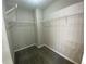 Walk-in closet provides ample storage with built-in shelving and gray carpet at 646 Lakes Cir, Lithonia, GA 30058