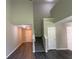 Hallway and stairway with modern flooring leading to upper level at 646 Lakes Cir, Lithonia, GA 30058