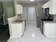 Open kitchen featuring white cabinetry, stainless steel appliances, and modern countertops at 646 Lakes Cir, Lithonia, GA 30058