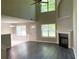 Spacious open concept living area featuring modern flooring and fireplace at 646 Lakes Cir, Lithonia, GA 30058