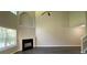 Bright, modern living room featuring high ceilings, and an inviting fireplace at 646 Lakes Cir, Lithonia, GA 30058
