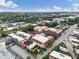 Aerial view showcasing a neighborhood with diverse building styles and tree coverage, under a blue sky at 322 Peters Sw St # 2, Atlanta, GA 30313