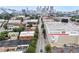 Aerial neighborhood view with downtown skyline, commercial buildings, and tree-lined roads at 322 Peters Sw St # 2, Atlanta, GA 30313