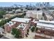 Stunning aerial view of a red brick apartment building, showing rooftop patio areas and surrounding cityscape at 322 Peters Sw St # 2, Atlanta, GA 30313