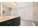 Modern bathroom featuring double vanity, large mirrors, glass shower and neutral tile flooring at 322 Peters Sw St # 2, Atlanta, GA 30313