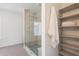 Bathroom showcasing walk-in glass shower, built in storage and large-format neutral tile at 322 Peters Sw St # 2, Atlanta, GA 30313