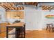 Well-lit kitchen and dining area featuring a modern design with exposed ceilings and hardwood floors at 322 Peters Sw St # 2, Atlanta, GA 30313