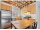 Kitchen showcasing stainless steel appliances, light wood cabinets, and wood floors at 322 Peters Sw St # 2, Atlanta, GA 30313