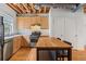Kitchen featuring wood cabinets, stainless steel appliances, and wood floors at 322 Peters Sw St # 2, Atlanta, GA 30313
