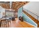 Open floor plan with exposed ceilings, hardwood floors, and a stylish staircase at 322 Peters Sw St # 2, Atlanta, GA 30313