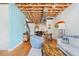 Bright living area with exposed ceiling, hardwood floors, and modern furnishings at 322 Peters Sw St # 2, Atlanta, GA 30313