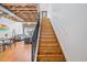 Inviting living area featuring exposed beam ceilings, wood floors, staircase and plenty of natural light at 322 Peters Sw St # 2, Atlanta, GA 30313