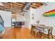Open floor plan with hardwood floors, exposed ceiling, and view of the kitchen at 322 Peters Sw St # 2, Atlanta, GA 30313