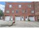 Rear of brick building with garages, private entrances, and convenient parking at 322 Peters Sw St # 2, Atlanta, GA 30313