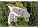 Aerial view of a home on a wooded lot with a long driveway, providing privacy at 4882 Rabbit Farm Road Rd, Loganville, GA 30052
