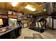 Finished basement with storage shelves, an office space, and exercise equipment creates a versatile area at 4882 Rabbit Farm Road Rd, Loganville, GA 30052