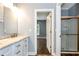 Bathroom featuring a single sink vanity, glass shower, and an open doorway to a bedroom at 4882 Rabbit Farm Road Rd, Loganville, GA 30052