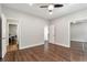 Neutral bedroom with hardwood floors, a closet and two doorways to other rooms at 4882 Rabbit Farm Road Rd, Loganville, GA 30052