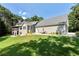 Beautiful exterior view of a large house with a lush lawn and patio seating area at 4882 Rabbit Farm Road Rd, Loganville, GA 30052