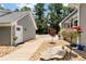 Landscaped exterior between house and garage featuring walkway and small garden at 4882 Rabbit Farm Road Rd, Loganville, GA 30052
