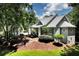 Inviting gray two-story home with manicured lawn, mature trees, and detached garage at 4882 Rabbit Farm Road Rd, Loganville, GA 30052