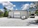 New metal building with a large garage door and adjacent RV parking creates a useful space at 4882 Rabbit Farm Road Rd, Loganville, GA 30052