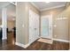 Hallway with wood floors, storage closet, and front door entrance at 4882 Rabbit Farm Road Rd, Loganville, GA 30052