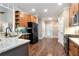 Spacious kitchen with wood floors, granite countertops, stainless appliances, and wood cabinets at 4882 Rabbit Farm Road Rd, Loganville, GA 30052
