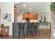 Kitchen with counter seating, wood cabinets, granite countertops, and stainless steel appliances at 4882 Rabbit Farm Road Rd, Loganville, GA 30052