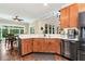Kitchen area with breakfast nook, stainless appliances, wood cabinets and large windows at 4882 Rabbit Farm Road Rd, Loganville, GA 30052