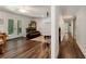 Living room with wood flooring, neutral walls, and glass patio doors leading to the backyard at 4882 Rabbit Farm Road Rd, Loganville, GA 30052