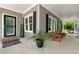 Inviting home with a covered front porch featuring welcome mat and chairs at 4882 Rabbit Farm Road Rd, Loganville, GA 30052