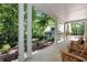 Inviting home featuring a long covered front porch with seating area at 4882 Rabbit Farm Road Rd, Loganville, GA 30052