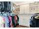 Organized walk-in closet with shelves, clothing rods, and ample storage space at 4882 Rabbit Farm Road Rd, Loganville, GA 30052