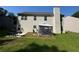 Two-story house backyard with patio and fenced lawn at 6432 Polar Fox Ct, Riverdale, GA 30296