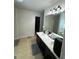 Bathroom featuring double sinks, modern fixtures, and a spacious layout at 6432 Polar Fox Ct, Riverdale, GA 30296