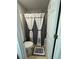 Cozy bathroom features a shower with stylish gray and white curtains and neutral tiled floors at 6432 Polar Fox Ct, Riverdale, GA 30296