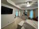 Spacious bedroom with tray ceiling, updated dresser, neutral carpet, and plenty of natural light at 6432 Polar Fox Ct, Riverdale, GA 30296